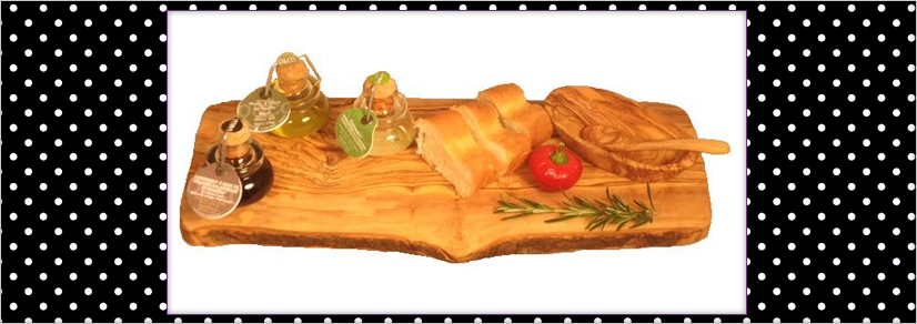 Large cheese board with cut bread and three jars